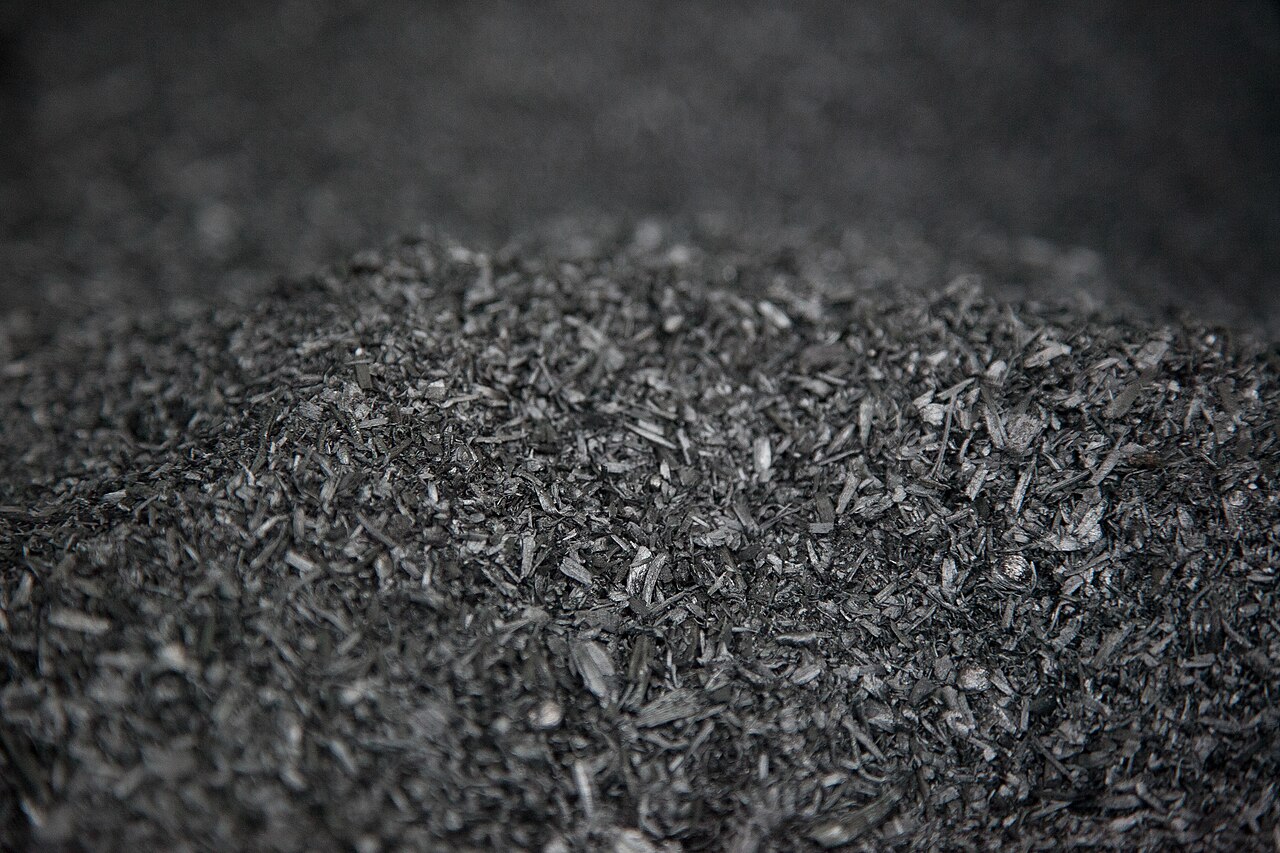 Close-up of a pile of black biochar granules